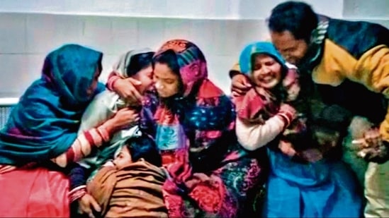 Families mourn at a hospital after spurious liquor claims the lives of 70 in Bihar. (AFP)