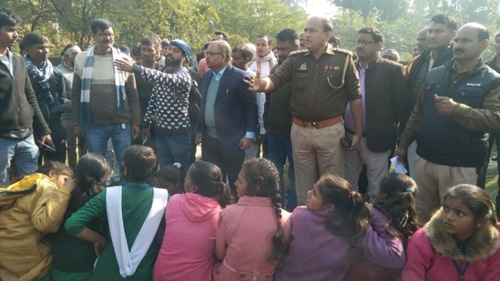 Rescued school students from the bus.(HT photo)