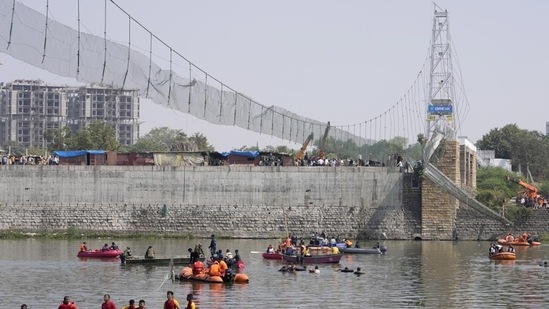 Days after it was reopened following renovation, the suspension bridge on the Machchu river in Morbi town collapsed on October 30, killing 135 people. (AP)