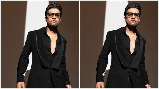 Here’s a picture of Vicky looking ravishing in a black shirt, buttoned down to his chest, layered with a black coat, with black sequin details at the borders. (Instagram/@vickykaushal09)