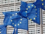 European Union flags flutter outside the EU Commission headquarters in Brussels, Belgium.