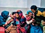 Families mourn at a hospital after spurious liquor claims the lives of 70 in Bihar. (AFP)