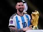 Argentina's Lionel Messi looks at the trophy after winning the World Cup final 2022 Argentina's Lionel Messi looks at the trophy after winning the World Cup final 2022