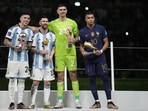Argentina's Enzo Fernandez, goalkeeper Emiliano Martinez, Lionel Messi and France's Kylian Mbappe, from left to right, pose with their individual awards Argentina's Enzo Fernandez, goalkeeper Emiliano Martinez, Lionel Messi and France's Kylian Mbappe, from left to right, pose with their individual awards