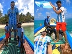 Football fans with Lionel Messi's giant cutout and Argentina flag. Football fans with Lionel Messi's giant cutout and Argentina flag.