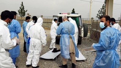 Afghanistan: Doctors collect the bodies of victims in a fuel tanker explosion in the Salang Tunnel. (AP) Afghanistan: Doctors collect the bodies of victims in a fuel tanker explosion in the Salang Tunnel. (AP)