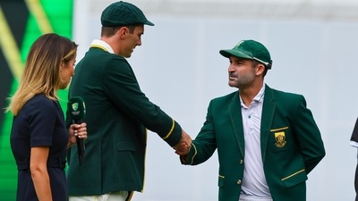 Pat Cummins shakes hands with Dean Elgar (AP)