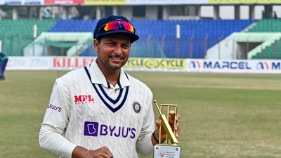 India's Kuldeep Yadav poses for a photo with the Man of the Match trophy during the fifth day of the first cricket Test match between Bangladesh and India India's Kuldeep Yadav poses for a photo with the Man of the Match trophy during the fifth day of the first cricket Test match between Bangladesh and India