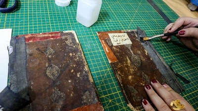Iraq: A conservator uses a fine brush to glue a Turkish-language astronomy manuscript. (AFP) Iraq: A conservator uses a fine brush to glue a Turkish-language astronomy manuscript. (AFP)