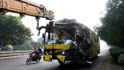 Noida, India- December 18, 2022: A Damaged bus gets towed by a towing truck as two buses carrying passengers collided with each other resulting in death of three people and others grievously injured in early hours of the morning at Noida-Greater Noida expressway in Noida, India, on Sunday, December 18, 2022. (Photo by Sunil Ghosh / Hindustan Times) (Hindustan Times) Noida, India- December 18, 2022: A Damaged bus gets towed by a towing truck as two buses carrying passengers collided with each other resulting in death of three people and others grievously injured in early hours of the morning at Noida-Greater Noida expressway in Noida, India, on Sunday, December 18, 2022. (Photo by Sunil Ghosh / Hindustan Times) (Hindustan Times)