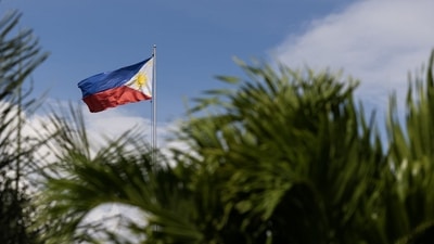 Philippines Economy: A Philippines flag outside the Ninoy Aquino International Airport (NAIA) in Manila. (Bloomberg)