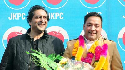 People's Conference chief Sajad Lone welcoming former National Conference leader Sameer Iqbal Bhat joins Jammu and Kashmir in Srinagar. (ANI)