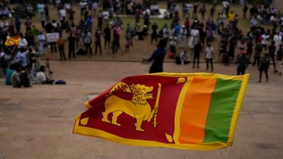 Sri Lanka: A Sri Lankan flag is waved by a protester. (AP) Sri Lanka: A Sri Lankan flag is waved by a protester. (AP)