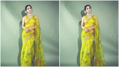 Hina decked up in the yellow chiffon saree featuring pink and silver zari borders. The saree also came with floral patterns in pastel green and silver. (Instagram/@realhinakhan) Hina decked up in the yellow chiffon saree featuring pink and silver zari borders. The saree also came with floral patterns in pastel green and silver. (Instagram/@realhinakhan)