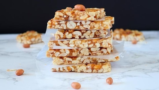 Chikki and Gajak : Even while packaged Chikki (peanut and jaggery brittles) and Gajak (jaggery and sesame brittles) are now available, the allure of obtaining some fresh, pure jaggery-made Gajak or Chikki from a thela (cart) remains strong. Standing with his thela, the vendor offers mungfali (peanuts), gajak, and chikki as options.(pinterest)