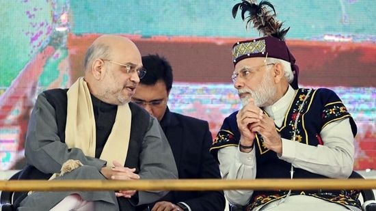 Prime Minister Narendra Modi interacts with Union Home Minister Amit Shah at the Golden Jubilee celebrations of the North Eastern Council (NEC), in Shillong.(ANI)