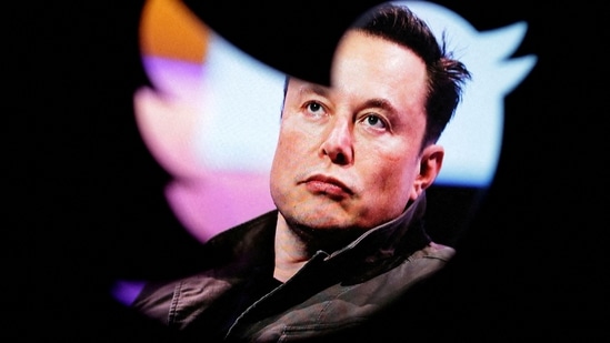 Elon Musk's photo is seen through a Twitter logo in this illustration. (REUTERS)