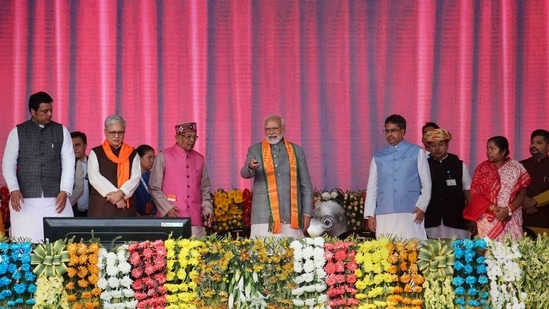 Prime Minister Narendra Modi lays foundation stone of developmental projects as Tripura chief minister Manik Saha and others look on during a public rally in Agartala on Sunday. (PTI)