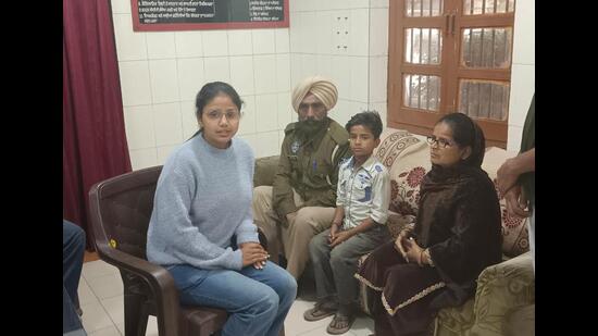 The boy being handed over to his family on Sunday.