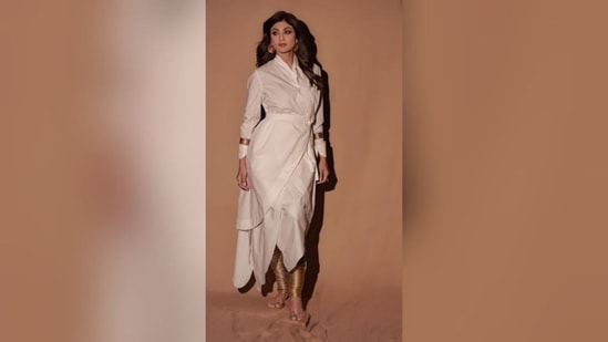 Shilpa Shetty's 'look of the day' features a white wrap dress featuring full sleeves, belt on the midriff and an asymmetrical hemline. (Instagram/@theshilpashetty)