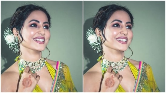Hina further teamed her saree with a matching blouse that came with halter neck details and similar patterns and backless details, with a knot detail at the back of the neck.&nbsp;(Instagram/@realhinakhan)