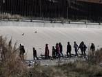 Migrants walk near the U.S.-Mexico border in Ciudad Juarez, Mexico, Monday.(AP) Migrants walk near the U.S.-Mexico border in Ciudad Juarez, Mexico, Monday.(AP)