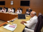 Gujarat chief minister Bhupendra Patel chairs first cabinet meeting with the newly sworn-in ministers, in Gandhinagar on December 12,.(PTI) Gujarat chief minister Bhupendra Patel chairs first cabinet meeting with the newly sworn-in ministers, in Gandhinagar on December 12,.(PTI)