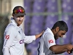 England's Rehan Ahmed, right, is congratulated by teammate Joe Root(AP) England's Rehan Ahmed, right, is congratulated by teammate Joe Root(AP)