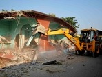 Assam: A JCB machine demolishes an illegal construction during an eviction drive in the 1,200 bighas (nearly 397 acres) of land from encroachment by alleged illegal migrants, at Batadrava, in Nagaon on Monday.(ANI) Assam: A JCB machine demolishes an illegal construction during an eviction drive in the 1,200 bighas (nearly 397 acres) of land from encroachment by alleged illegal migrants, at Batadrava, in Nagaon on Monday.(ANI)