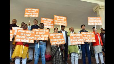 BJP MLAs stage a protest over the alleged deteriorating law and order situation in view of the Sahibganj murder case in Ranchi on Monday. (ANI) BJP MLAs stage a protest over the alleged deteriorating law and order situation in view of the Sahibganj murder case in Ranchi on Monday. (ANI)