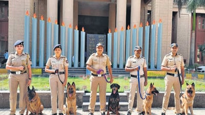 Five well-groomed and trained dogs strike a pose with their handlers attached to the crime detection dogs unit of the Mumbai police at the police headquarter. (HT Photo) Five well-groomed and trained dogs strike a pose with their handlers attached to the crime detection dogs unit of the Mumbai police at the police headquarter. (HT Photo)
