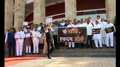 Opposition MLAs stage a protest against the Maharashtra-Karnataka border issue on the first day of the Winter Session of the Maharashtra Assembly, in Nagpur on Monday. (ANI PHOTO)