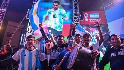 Kolkata: Argentina fans celebrate after Lionel Messi scores a goal at the FIFA World Cup 2022 final match. (PTI)