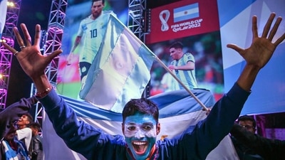 A fan of Argentina cheers in Kolkata while celebrating his team's victory in the final. (PTI) A fan of Argentina cheers in Kolkata while celebrating his team's victory in the final. (PTI)