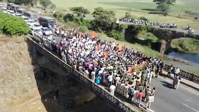 Protesters detained at Koganolli checkpoint border on Pune-Bengaluru national highway. (ANI) Protesters detained at Koganolli checkpoint border on Pune-Bengaluru national highway. (ANI)