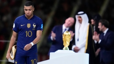 France's Kylian Mbappe walks with the Golden Boot award (AP) France's Kylian Mbappe walks with the Golden Boot award (AP)