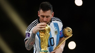 Lionel Messi kisses the FIFA World Cup trophy. (REUTERS)