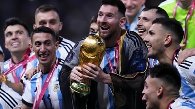 Argentina's Lionel Messi and teammates celebrate with the World Cup trophy after Argentina defeated France in the World Cup final 2022 (AP) Argentina's Lionel Messi and teammates celebrate with the World Cup trophy after Argentina defeated France in the World Cup final 2022 (AP)