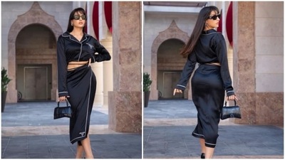 In another set of latest Instagram pictures, Nora Fatehi was spotted in her glamorous avatar once again in a black satin co-ord set. (Instagram/@norafatehi) In another set of latest Instagram pictures, Nora Fatehi was spotted in her glamorous avatar once again in a black satin co-ord set. (Instagram/@norafatehi)