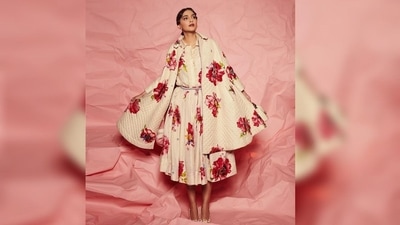 Sonam Kapoor opted for a maxi-length dress featuring a flared hemline, red flowers all over her white dress and a sleek belt. The neckline came decorated with white lace that added extra grace to her outfit. (Instagram/@sonamkapoor) Sonam Kapoor opted for a maxi-length dress featuring a flared hemline, red flowers all over her white dress and a sleek belt. The neckline came decorated with white lace that added extra grace to her outfit. (Instagram/@sonamkapoor)