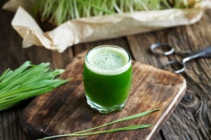 Wheatgrass contains iron, calcium, magnesium and amino acids. It helps in reducing blood pressure and promoting higher metabolism of the body. (Unsplash)