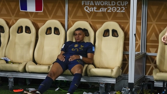 France's Kylian Mbappe sits on the bench at the end of the World Cup final (AP)