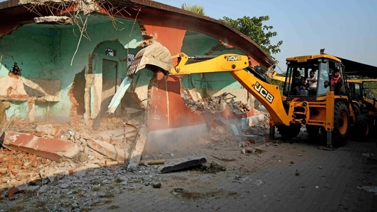 Assam: A JCB machine demolishes an illegal construction during an eviction drive in the 1,200 bighas (nearly 397 acres) of land from encroachment by alleged illegal migrants, at Batadrava, in Nagaon on Monday.(ANI) Assam: A JCB machine demolishes an illegal construction during an eviction drive in the 1,200 bighas (nearly 397 acres) of land from encroachment by alleged illegal migrants, at Batadrava, in Nagaon on Monday.(ANI)