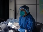 A worker in protective gear at a Covid testing station in Macau, China, on Monday. 