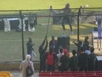 England coach Brendon McCullum climbs up a fence for Pakistan fans England coach Brendon McCullum climbs up a fence for Pakistan fans