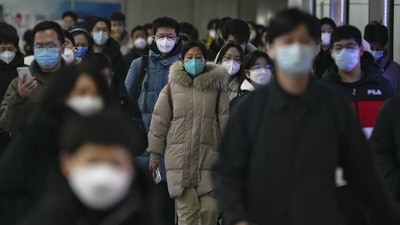 Masked commuters at a subway station during the morning rush hour in Beijing, on December 20. In wake of the Chinese government’s decision to lift the Covid curbs, cases have seen an upward rise across the country, AFP reported. (Andy Wong / AP) Masked commuters at a subway station during the morning rush hour in Beijing, on December 20. In wake of the Chinese government’s decision to lift the Covid curbs, cases have seen an upward rise across the country, AFP reported. (Andy Wong / AP)