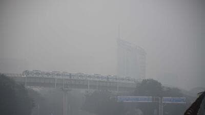 A Rapid Metro train amid dense fog at DLF phase 3 near cyber city Metro station in Gurugram on Tuesday. (Parveen Kumar/HT Photo) A Rapid Metro train amid dense fog at DLF phase 3 near cyber city Metro station in Gurugram on Tuesday. (Parveen Kumar/HT Photo)