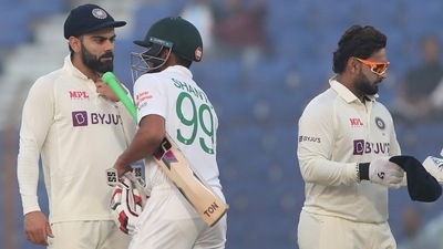 India's Virat Kohli, left, speaks to Bangladesh's Najmul Hossain Shanto, second left, as India's Kuldeep Yadav, right and Rishabh Pant leave the ground (AP) India's Virat Kohli, left, speaks to Bangladesh's Najmul Hossain Shanto, second left, as India's Kuldeep Yadav, right and Rishabh Pant leave the ground (AP)