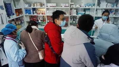 People queue to buy antigen test kits at a pharmacy amid the Covid-19 pandemic in Hangzhou, in China's eastern Zhejiang province. (AFP) People queue to buy antigen test kits at a pharmacy amid the Covid-19 pandemic in Hangzhou, in China's eastern Zhejiang province. (AFP)