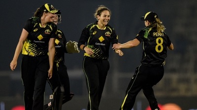 Heather Graham (2R) celebrates with teammates after taking the wicket of Renuka Singh (not pictured), which also saw her complete a hattrick in the 5th T20I (AFP) Heather Graham (2R) celebrates with teammates after taking the wicket of Renuka Singh (not pictured), which also saw her complete a hattrick in the 5th T20I (AFP)